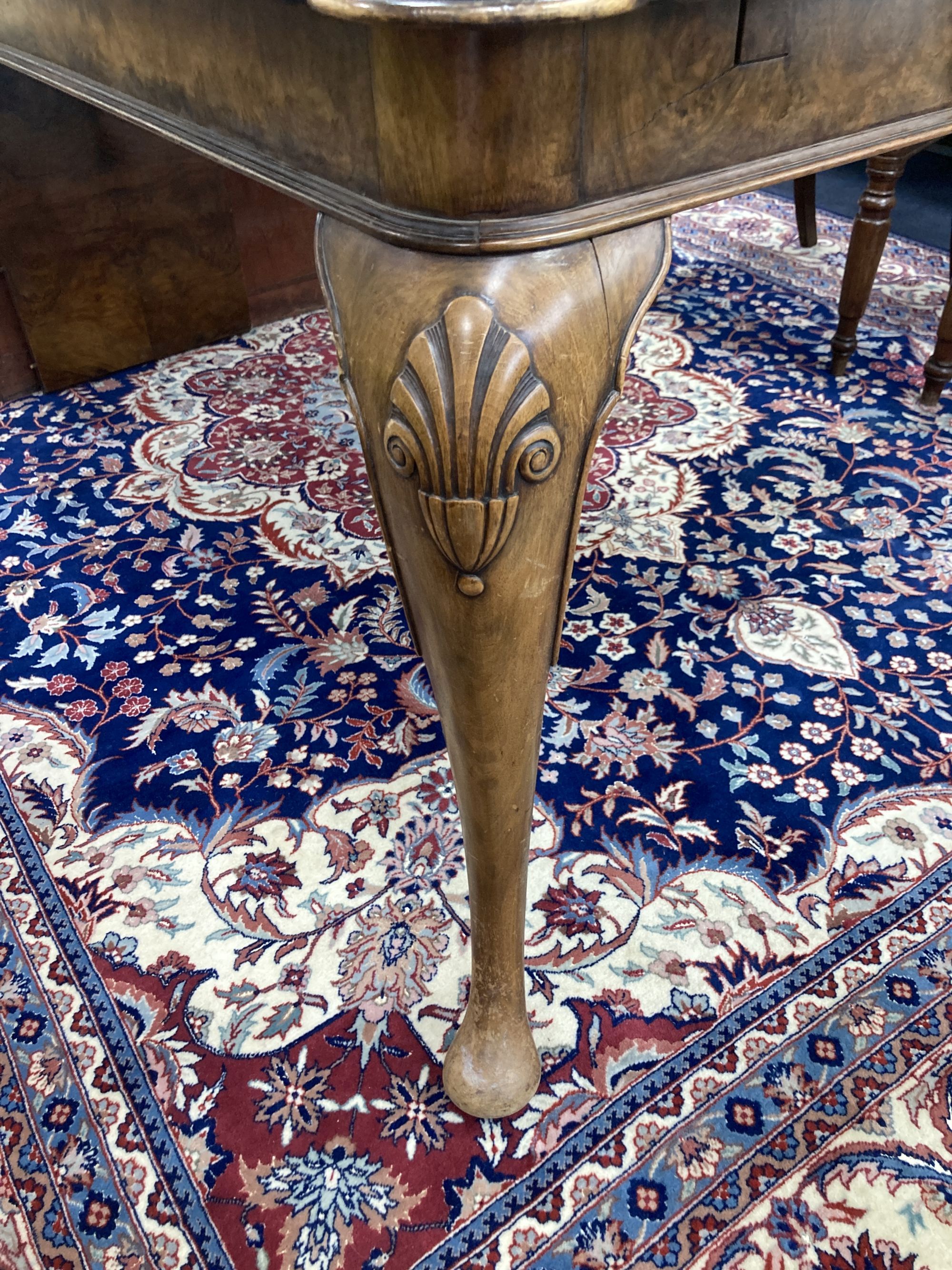 A Queen Anne revival walnut extending dining table, length 182cm extended (one spare leaf), width 90cm, height 74cm